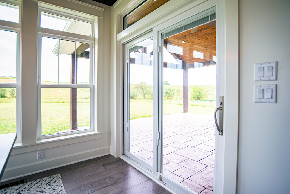 a home featuring a window and sliding glass door with Energy Efficient Windows in Largo, FL